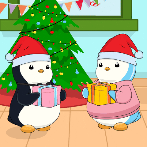 Two penguins wearing Santa hats are holding presents in front of a decorated Christmas tree inside a room. There may be a small 'Lee' logo or label on the window.