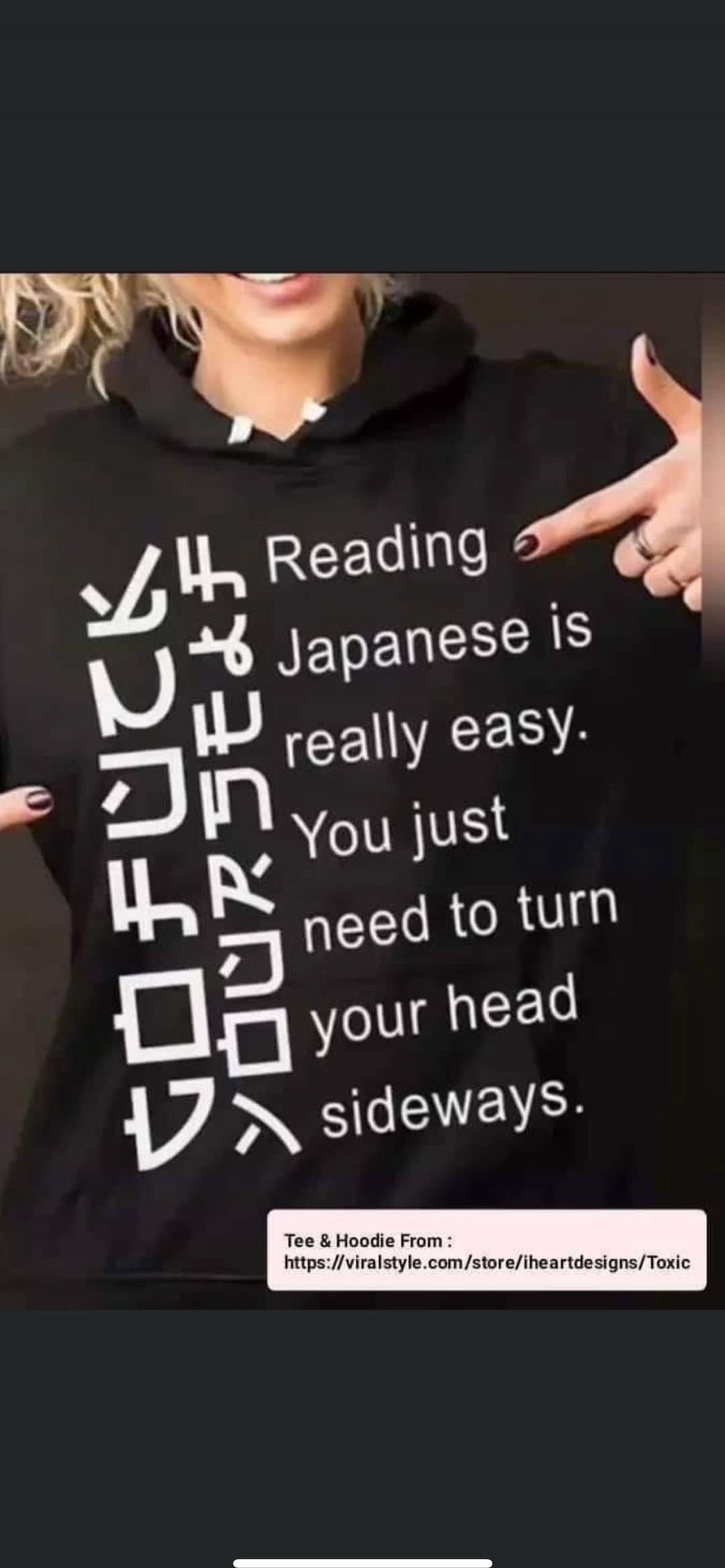 Reading Japanese is really easy. You just need to turn your head sideways. (The Japanese-like characters on the left side of the hoodie, when read sideways, spell 'FUCK YOURSELF').
