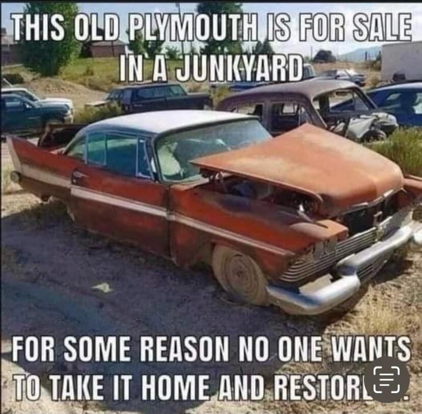 This old Plymouth is for sale in a junkyard. For some reason, no one wants to take it home and restore it.