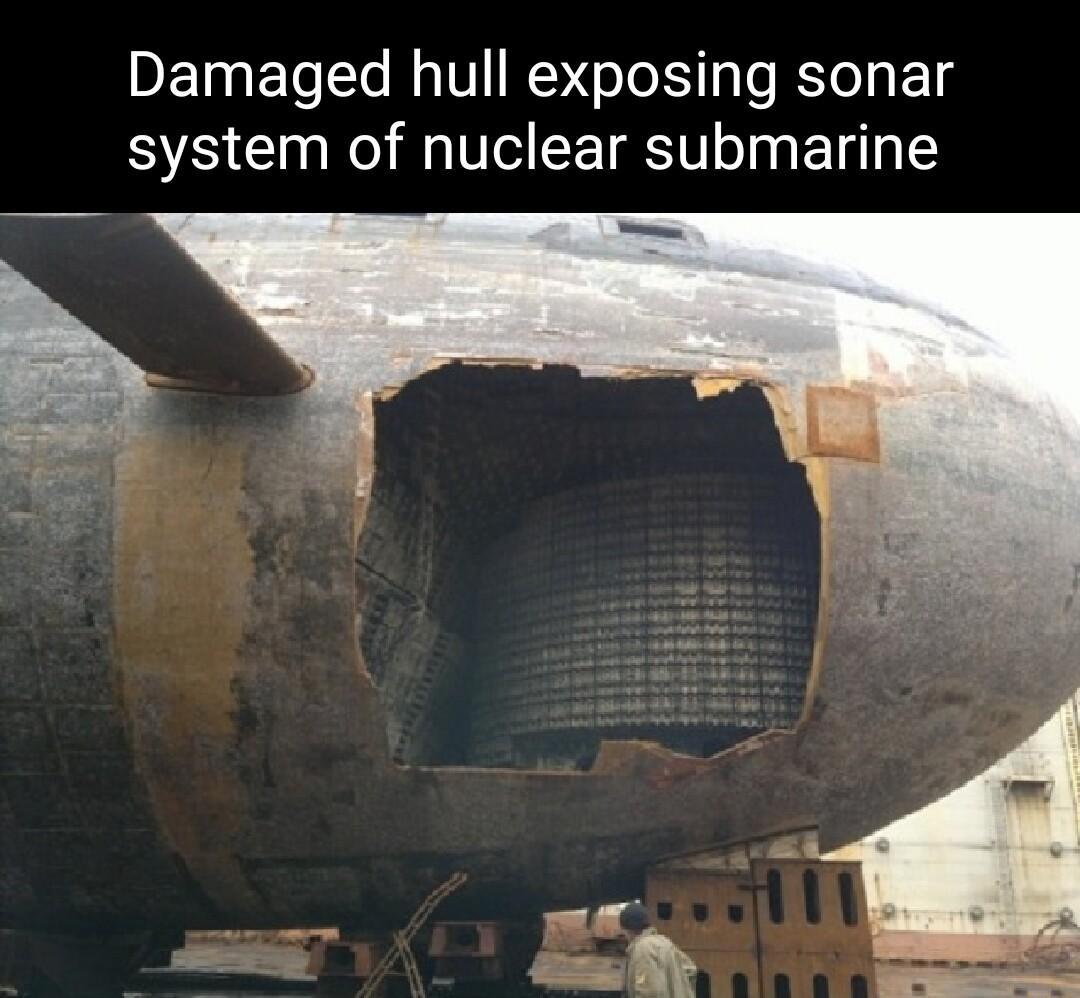 Damaged hull exposing sonar system of nuclear submarine