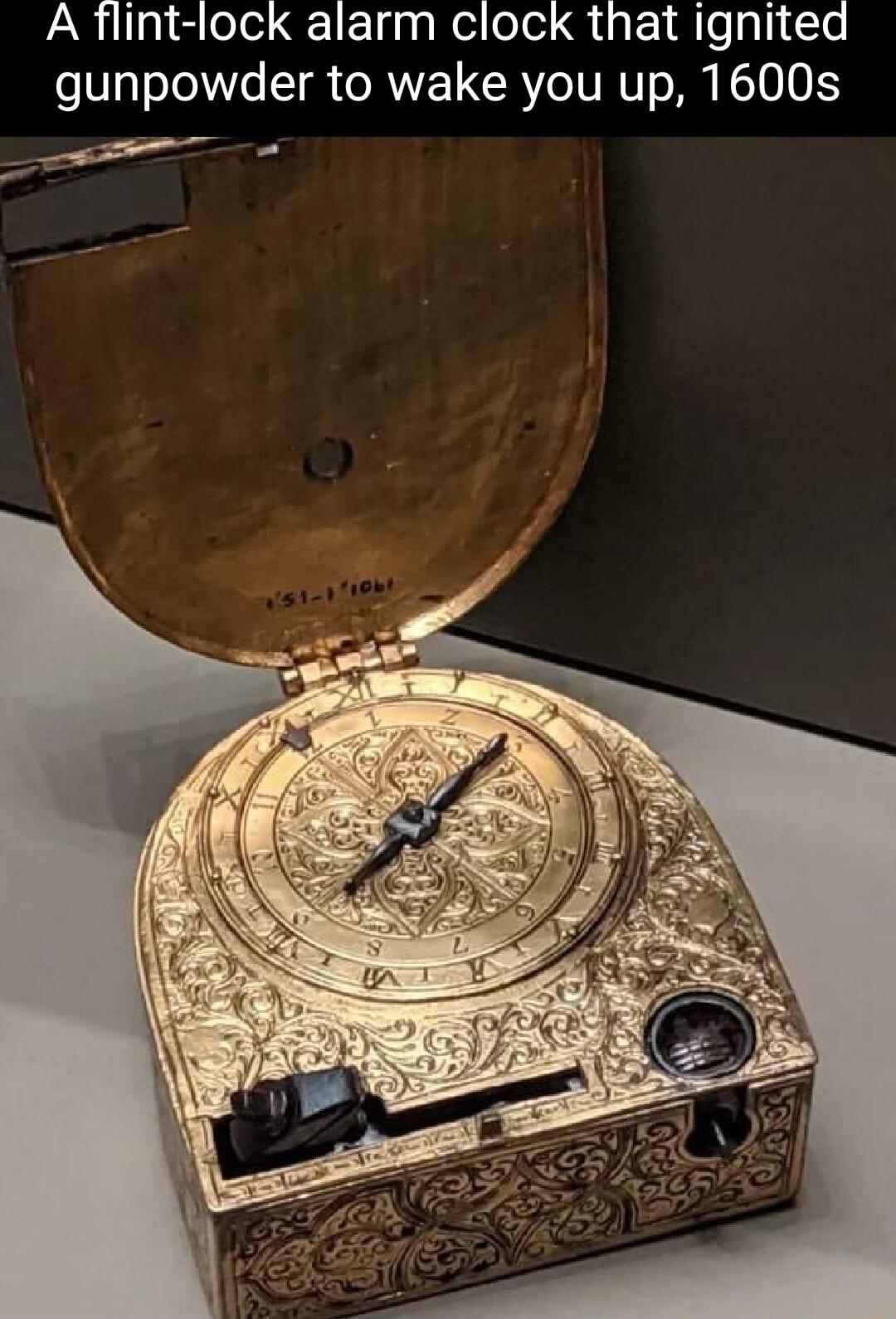 A flint lock alarm clock that ignited gunpowder to wake you up 1600s e