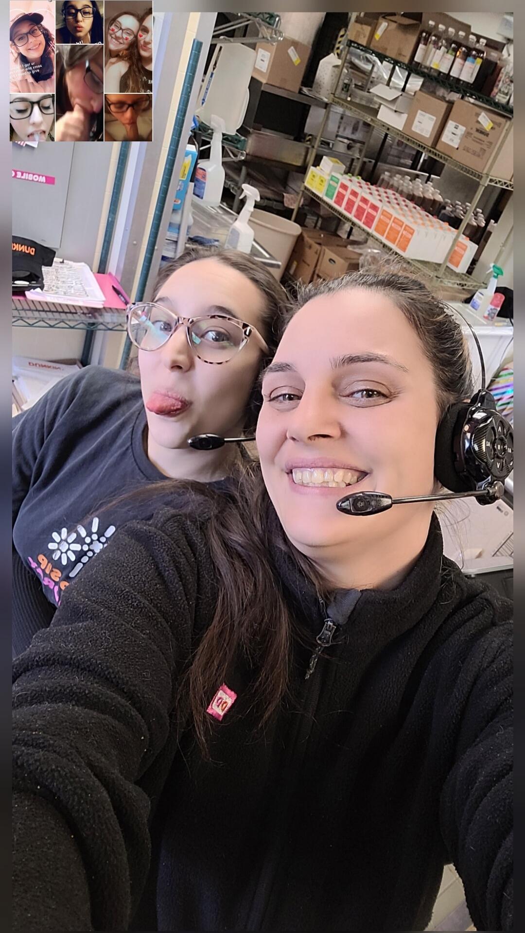 Two women are taking a selfie in what appears to be a workplace. One woman is smiling and wearing a headset, while the other is playfully sticking out her tongue and wearing glasses with a headset microphone. In the top left corner, a small collage of other selfies is visible, with one image containing the text: 