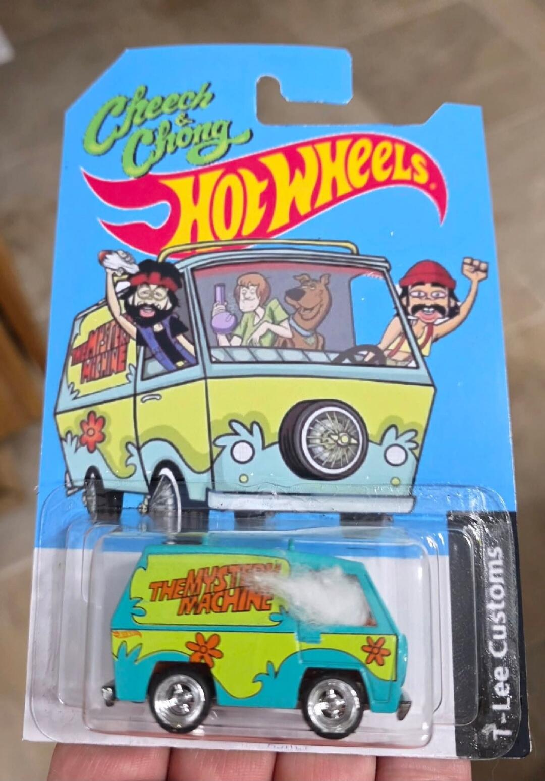 Cheech & Chong Hot Wheels THE MYSTERY MACHINE T-Lee Customs. An illustration of the Mystery Machine van with Shaggy and Scooby-Doo inside, along with a bong. Cheech and Chong characters are depicted outside the van, one holding a joint. The toy car has cotton wool simulating smoke coming from the window.