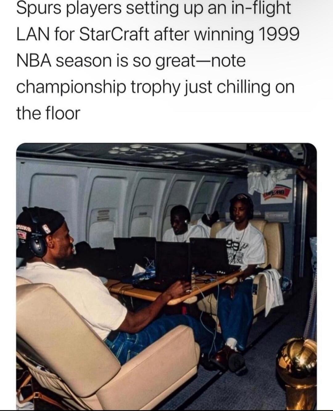 purs players setting up an in flight LAN for StarCraft after winning 1999 NBA season is so greatnote championship trophy just chilling on the floor