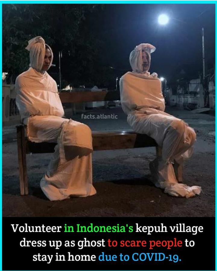 Volunteer in Indonesias kepuh village dress up as ghost to scare people to stay in home due to COVID 19