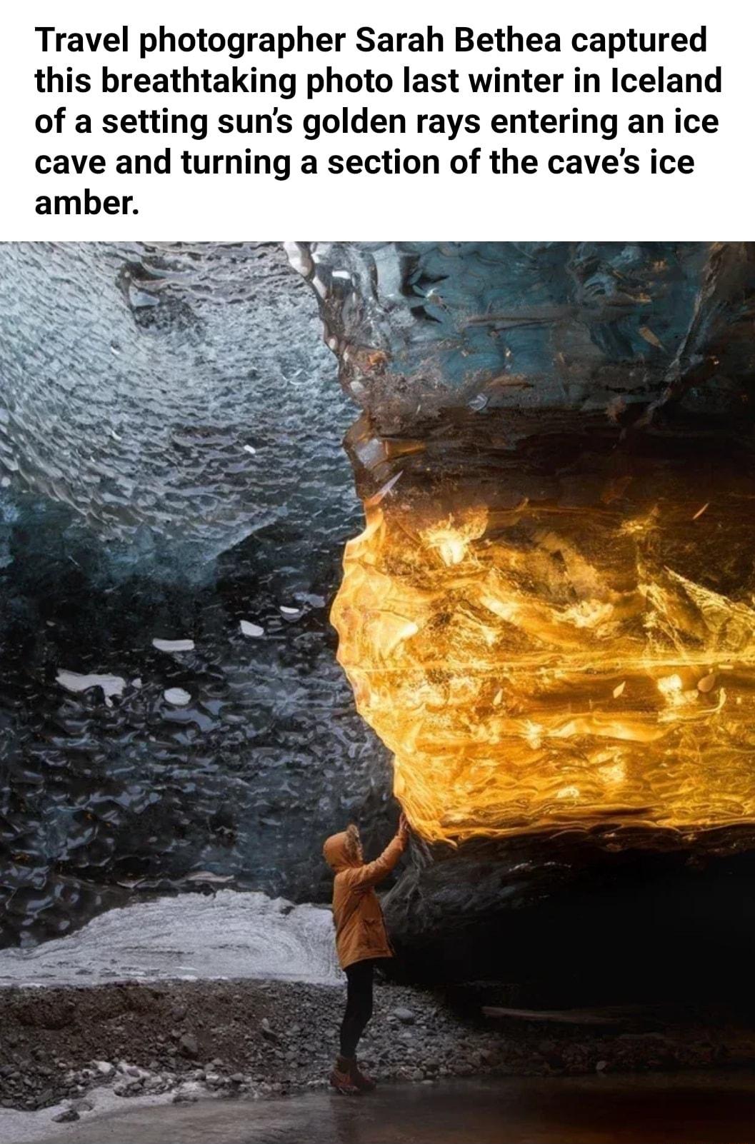 Travel photographer Sarah Bethea captured this breathtaking photo last winter in Iceland of a setting suns golden rays entering an ice cave and turning a section of the caves ice amber