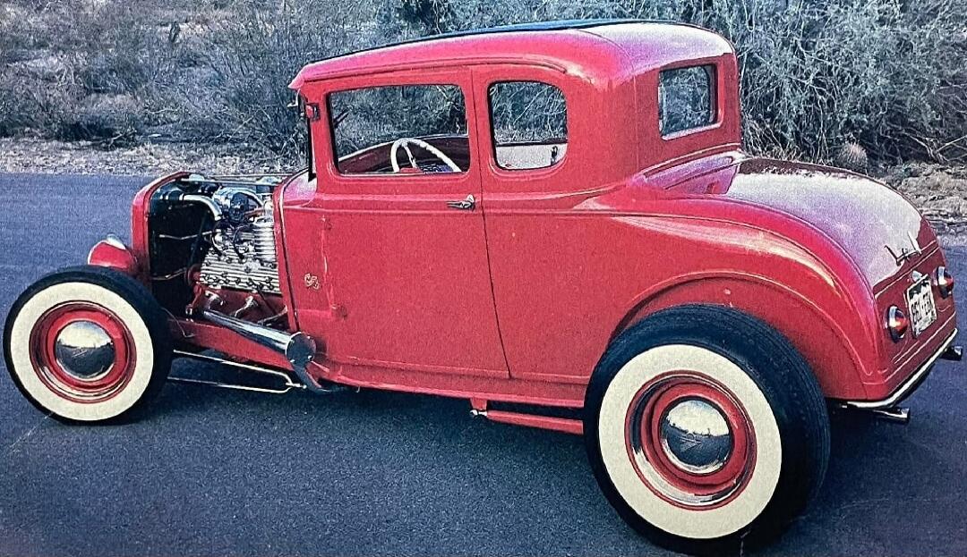 Session ID: 1064746. Red vintage hot rod car with whitewall tires.