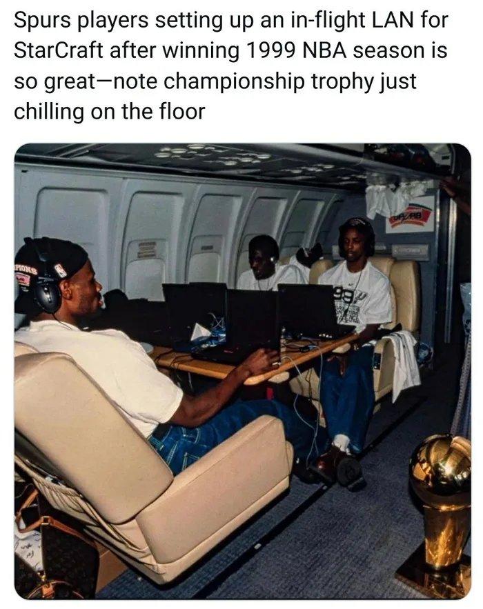 Spurs players setting up an in flight LAN for StarCraft after winning 1999 NBA season is so greatnote championship trophy just chilling on the floor