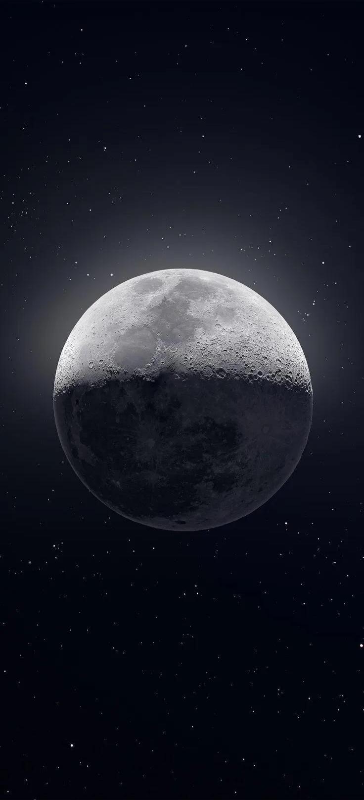The moon is shown in space with stars.