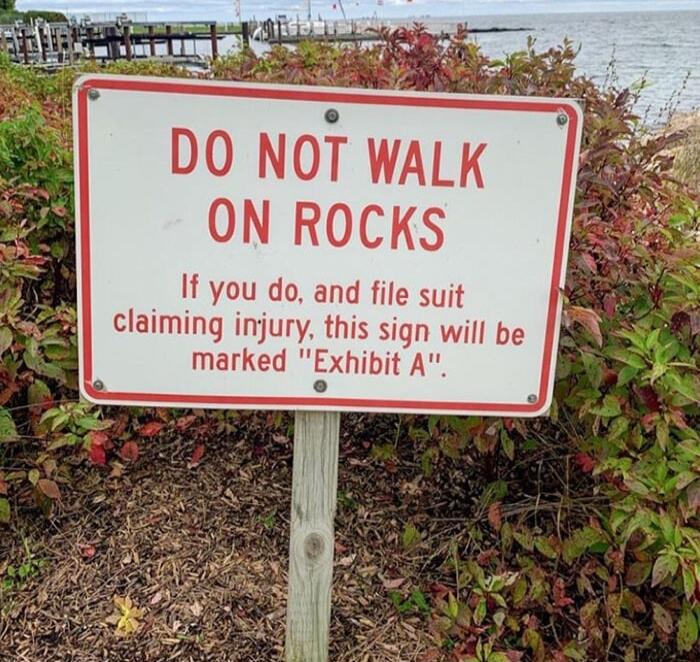 DO NOT WALK ON ROCKS If you do and file suit claiming injury this sign will be l marked Exhibit A o