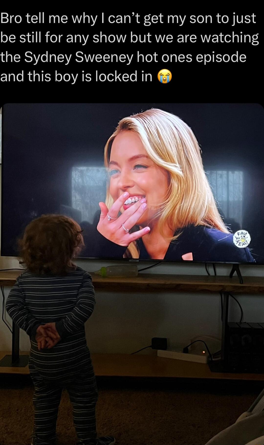 Bro tell me why cant get my son to just be still for any show but we are watching the Sydney Sweeney hot ones episode and this boy is locked in