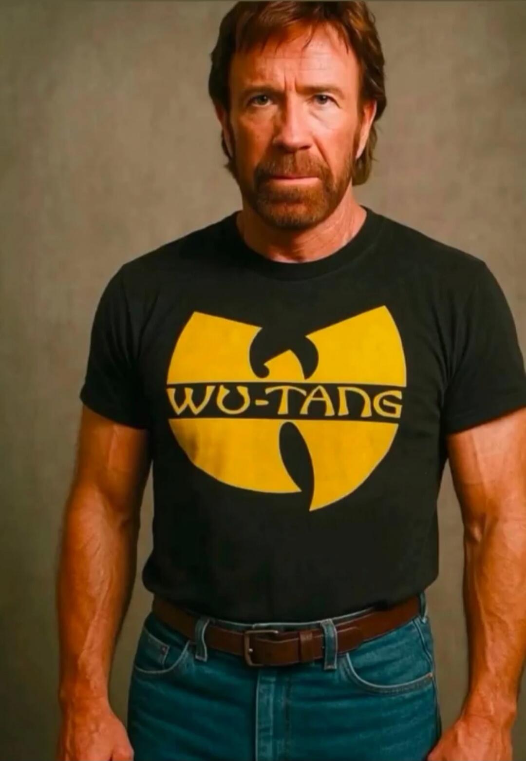 Chuck Norris wearing a black t-shirt with the yellow Wu-Tang Clan logo and 'WU-TANG' text.