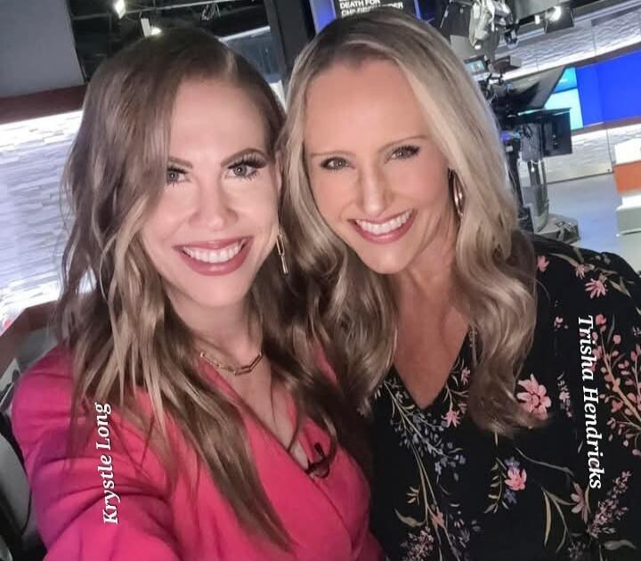 Krystle Long, Trisha Hendricks. Two women smiling in a news studio.