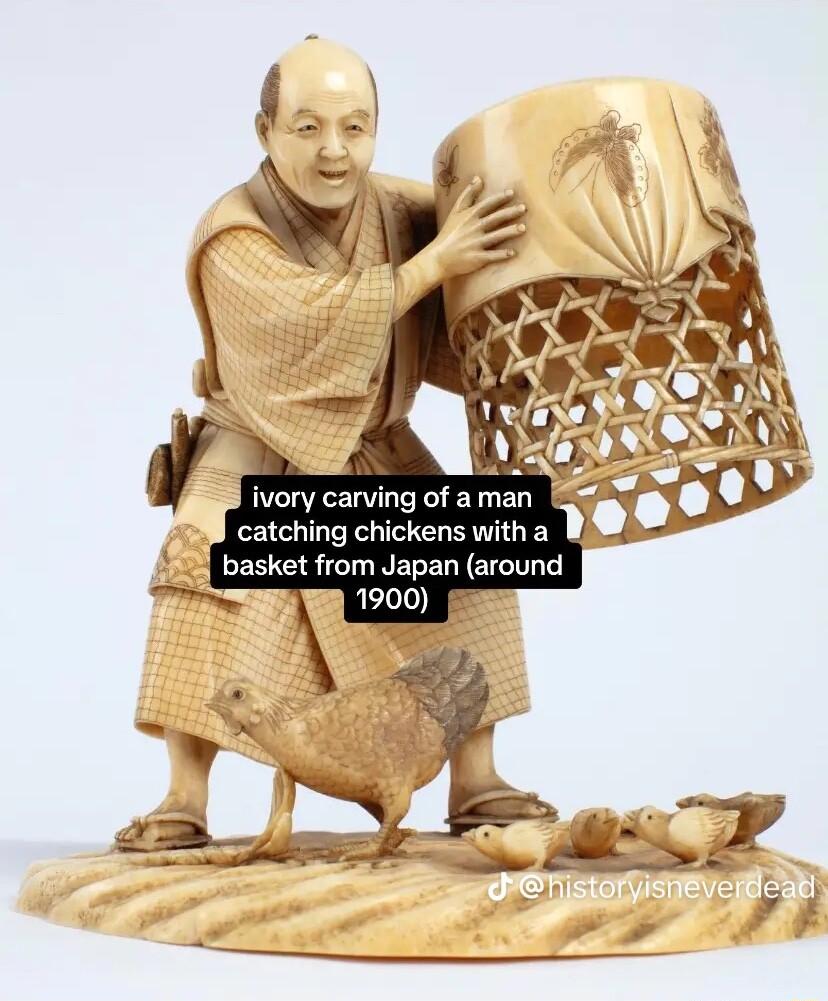 ivory carving of aman catching chickens witha B3