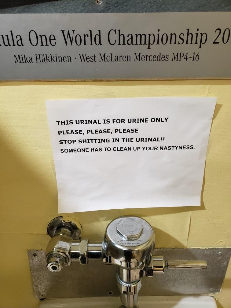 THIS URINAL IS FOR URINE ONLY PLEASE PLEASE PLEASE STOP SHITTING IN THE URINAL SOMEONE HAS TO CLEAN UP YOUR NASTYNESS