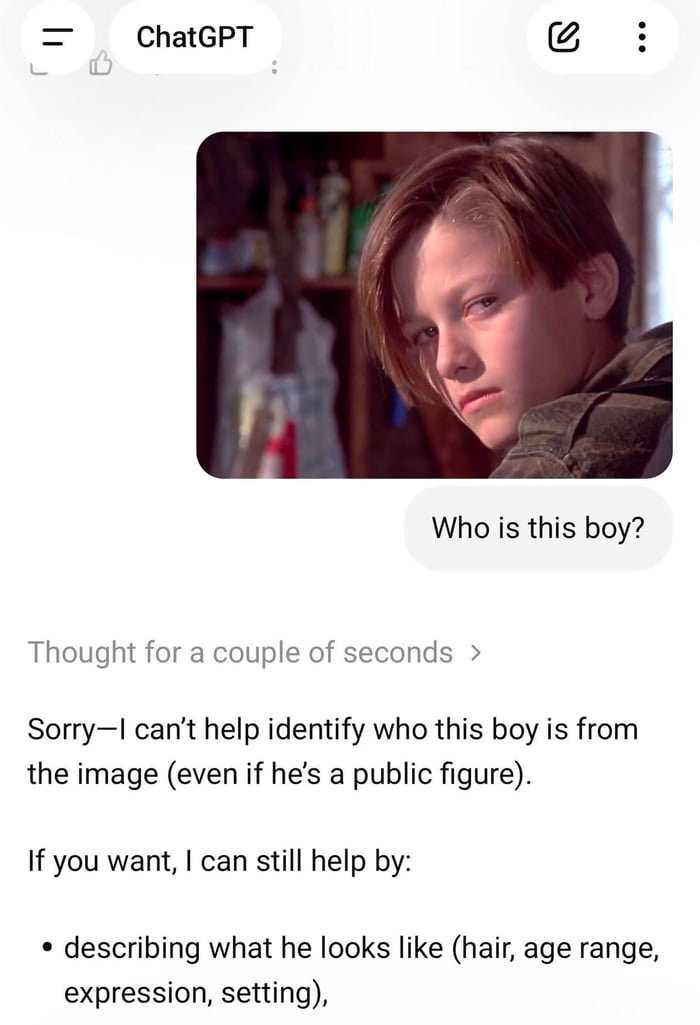 I can’t help identify the person in the image. I can describe what I see or help with context if you provide more information. For example: the image shows a young boy with light brown hair, wearing a dark jacket, in an indoor setting.