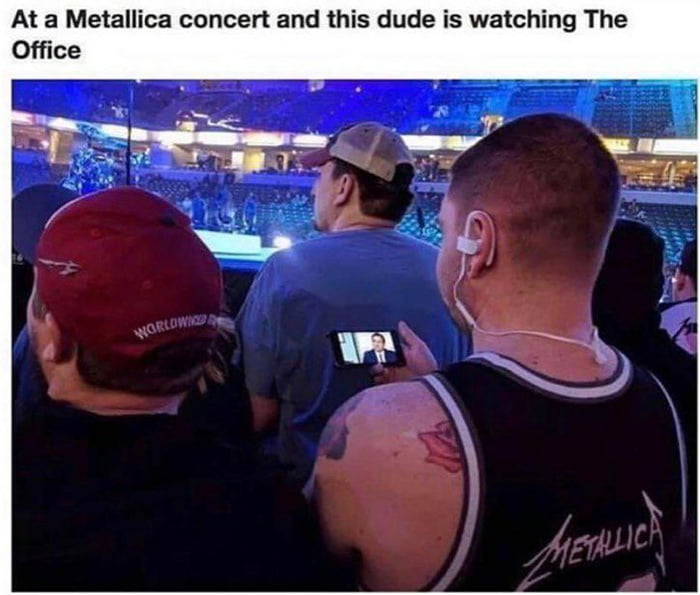 At a Metallica concert and this dude is watching The Office
