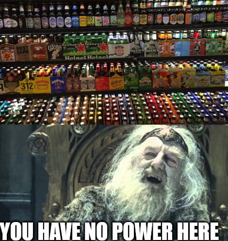 A large display of various beer bottles in a refrigerated section of a store. Below, Gandalf from Lord of the Rings is shown with the text: 