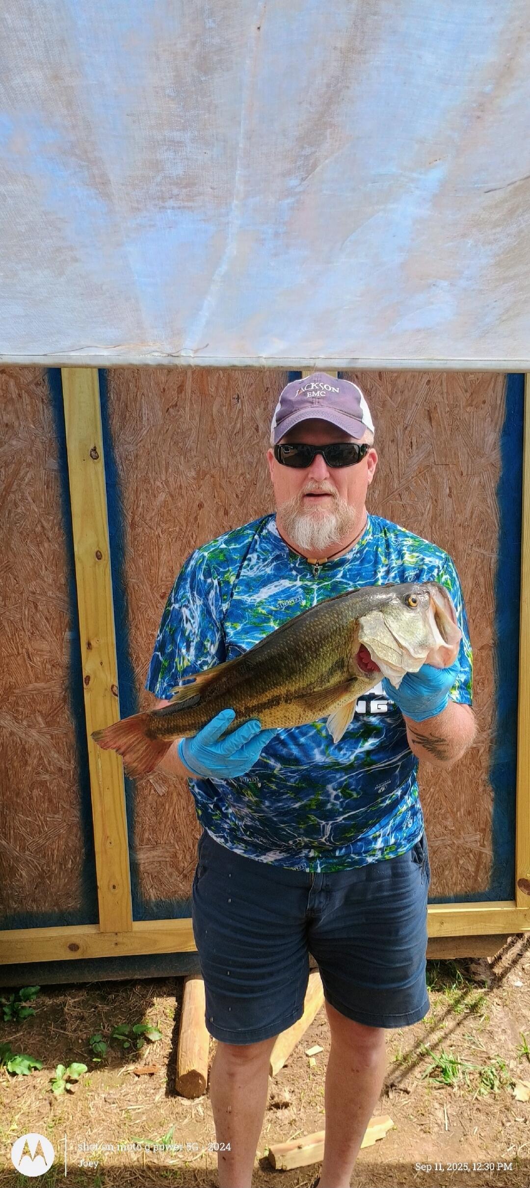 Man holding a large fish.