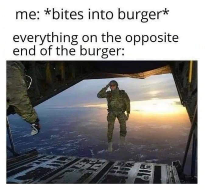 me bites into burger everything on the opposite end of the burger