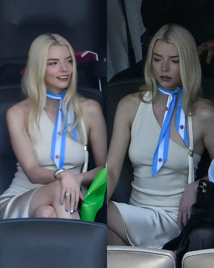 Anya Taylor-Joy is seen sitting, wearing a light dress and a blue and white scarf.