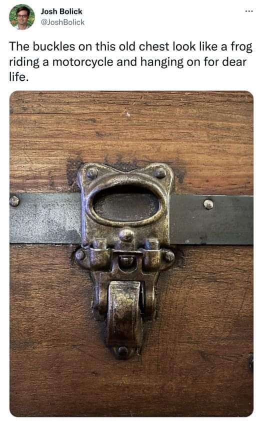 The buckles on this old chest look like a frog riding a motorcycle and hanging on for dear life