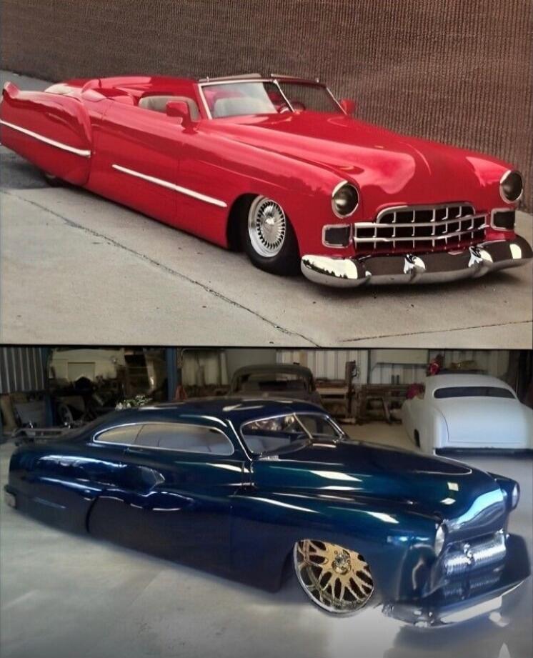 Two customized classic cars: a bright red convertible lowrider with a chrome grille and white-wall accents, and a deep blue custom coupe with a smooth, lowered body and large gold wheels.