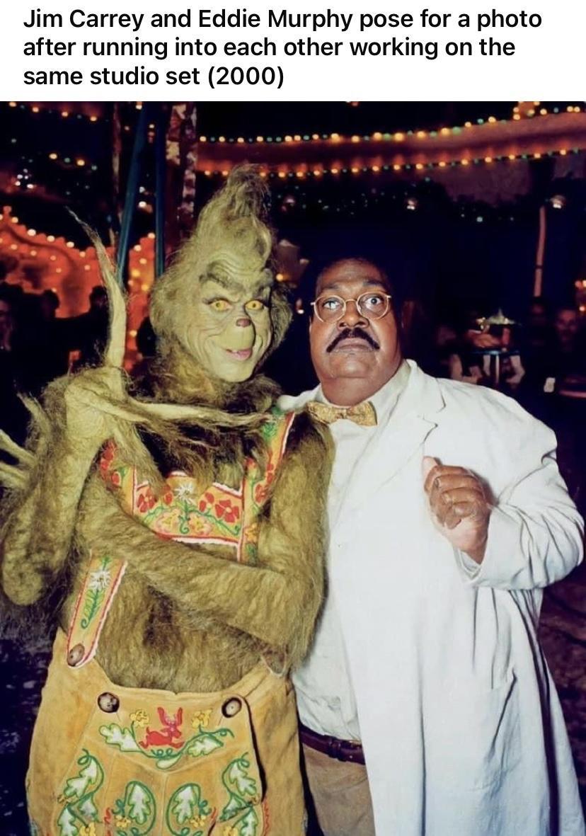 Jim Carrey and Eddie Murphy pose for a photo after running into each other working on the same studio set 2000