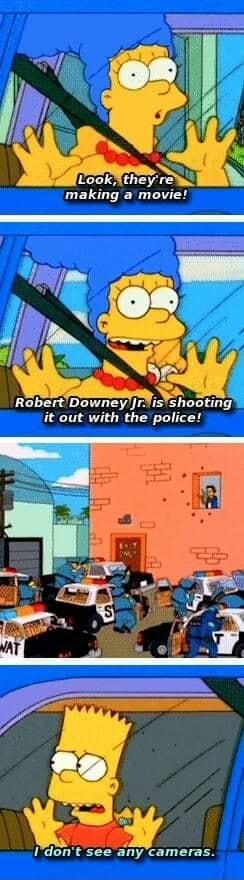 making a movie f e m SR RobertDowneyrisshootin it out with the police S Idont see any cameras