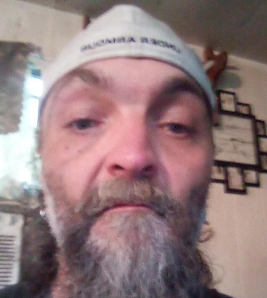 Cap text is unclear due to blurriness.