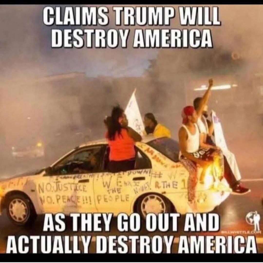 CLAIMS TRUMP WILL DESTROY AMERICA AS THEY GO OUT AND ACTUALLY DESTROY AMERICA. On the car: NO JUSTICE NO PEACE!!! PEOPLE, WE ARE THE NIGHT, R THE 1.