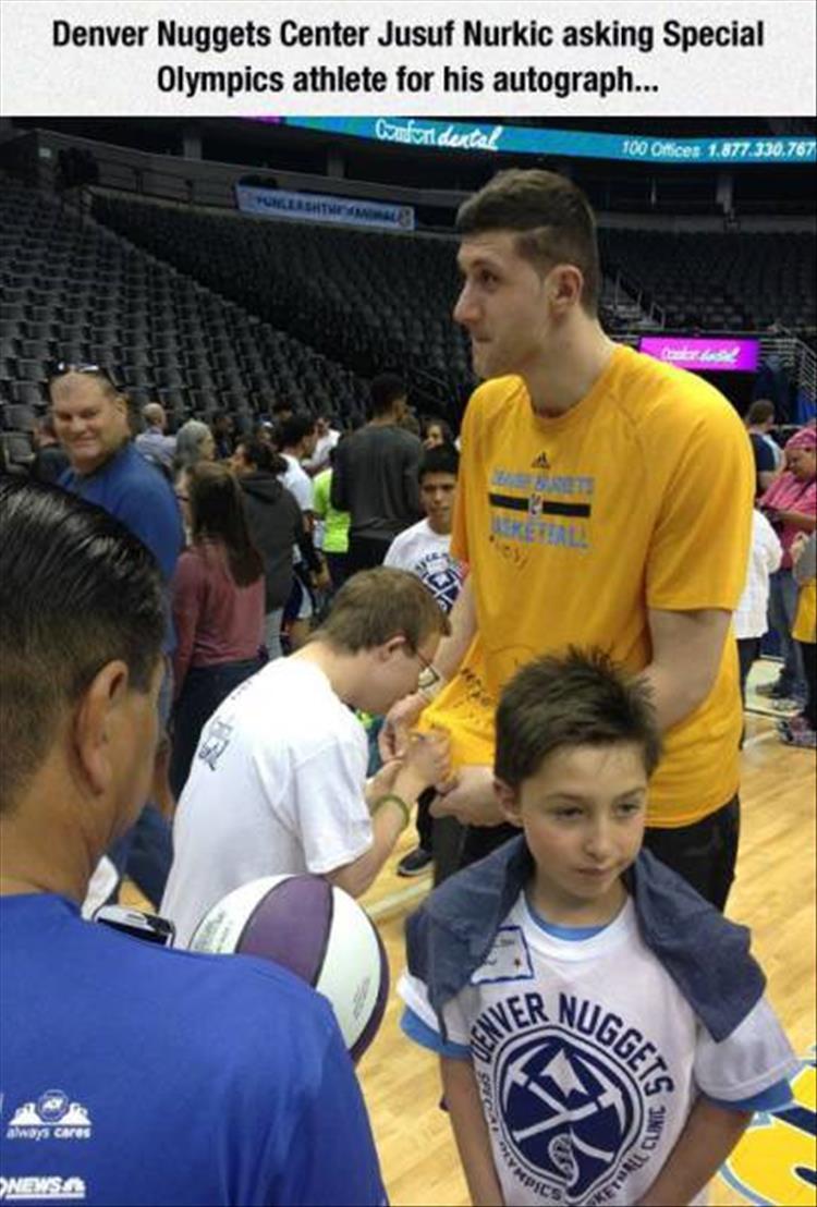 Denver Nuggets Center Jusuf Nurkic asking Special Olympics athlete for his autograph