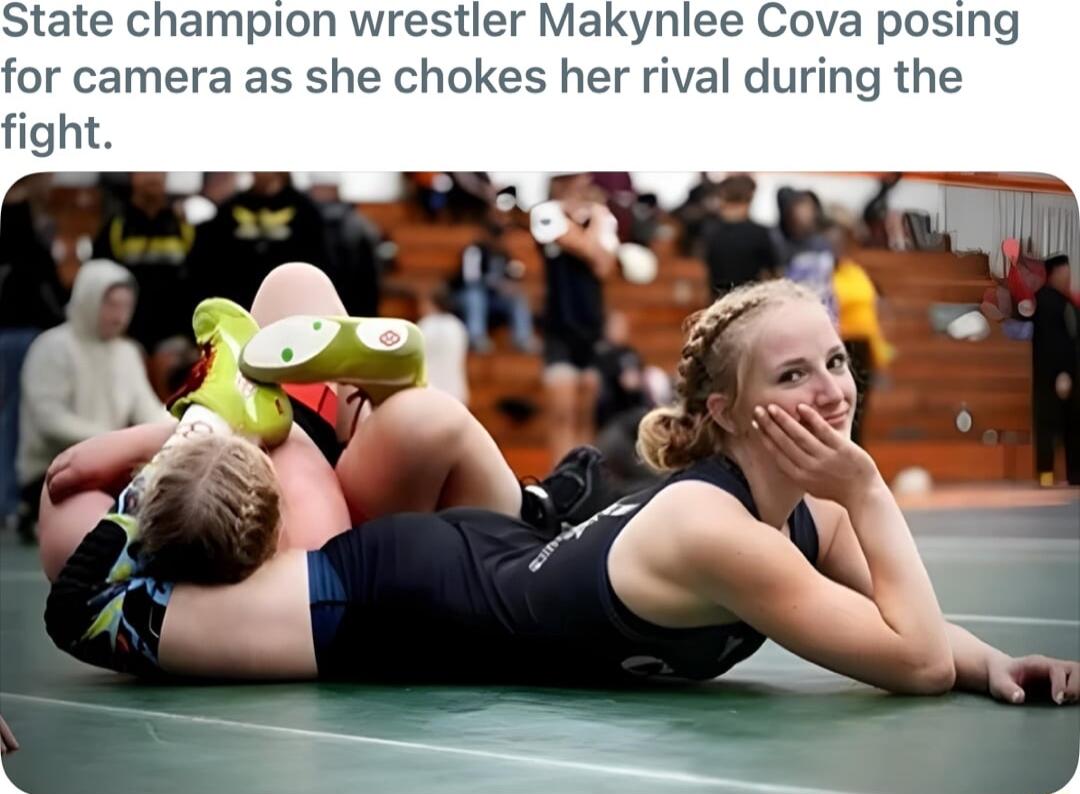 tate champion wrestler Makynlee Cova posing for camera as she chokes her rival during the fight
