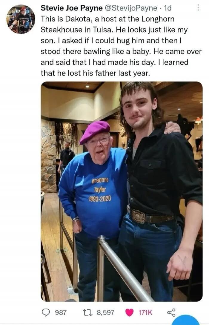 This is Dakota, a host at the Longhorn Steakhouse in Tulsa. He looks just like my son. I asked if I could hug him and then I stood there bawling like a baby. He came over and said that I had made his day. I learned that he lost his father last year.
[Image: A man in a purple hat and an elderly man in a blue shirt with the text 'Breonna Taylor 1993-