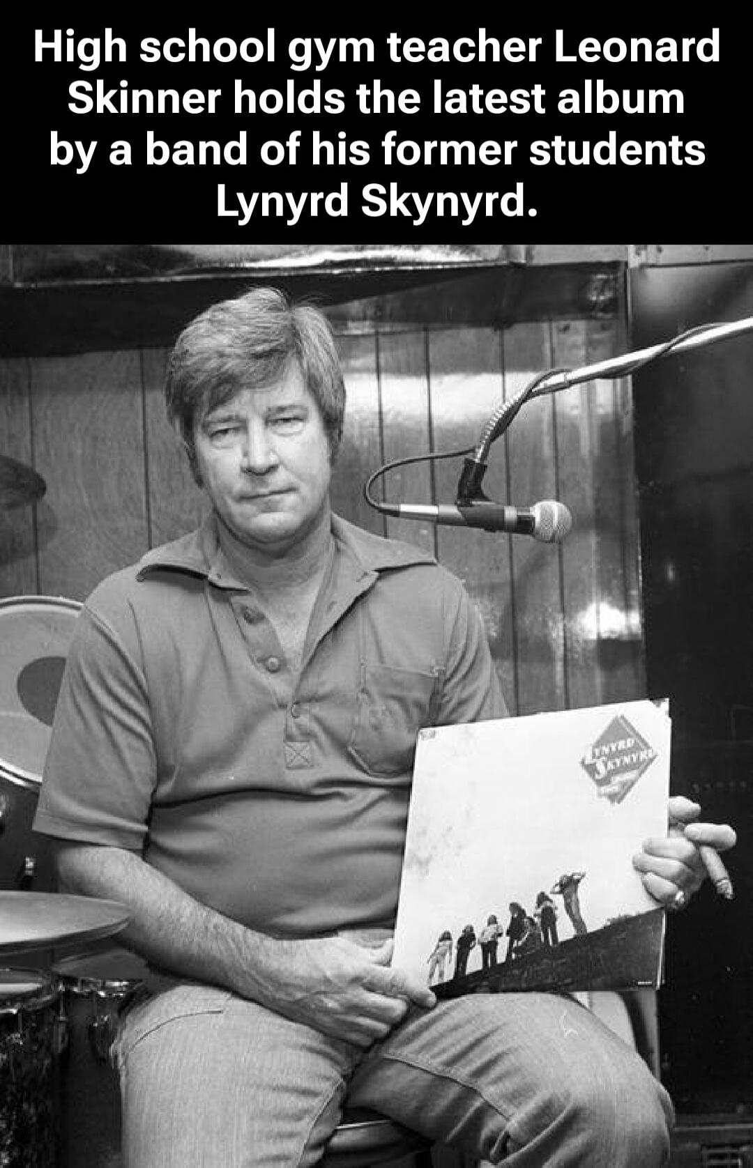 High school gym teacher Leonard Skinner holds the latest album by a band of his former students Lynyrd Skynyrd.
