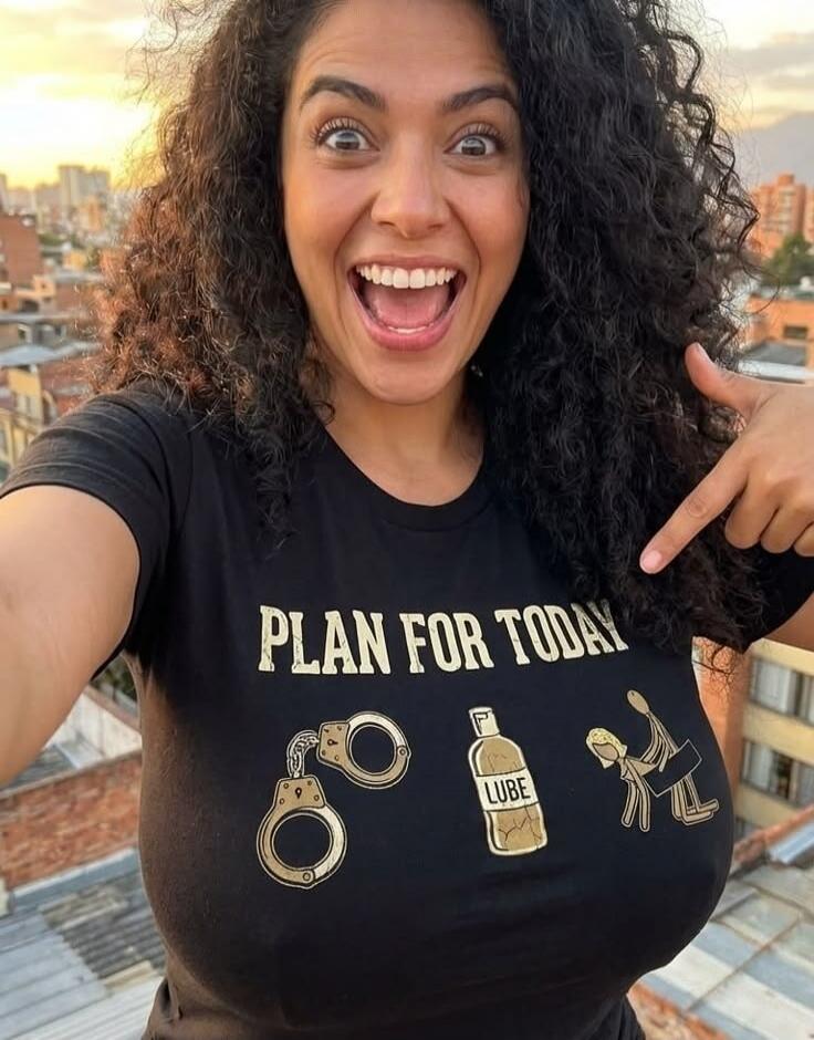 PLAN FOR TODAY LUBE. A woman is smiling and pointing at her t-shirt with suggestive graphics.