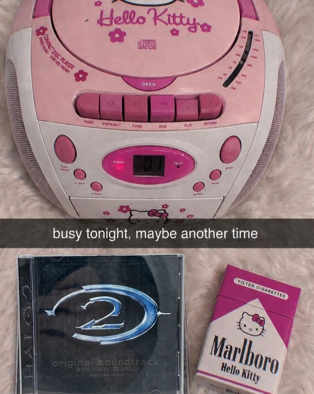 Hello Kitty COMPACT DISC PLAYER DIGITAL AUDIO OPEN PAUSE STOP/EJECT F.FWD REW PLAY RECORD PLAY/PAUSE POWER FM ST STOP PROG REPEAT R. SKIP F. SKIP FM 88 92 96 100 104 108 AM 530 600 700 800 900 1000 1200 1400 1600 busy tonight, maybe another time HALO 2 original soundtrack and new music volume one FILTER CIGARETTES Marlboro Hello Kitty