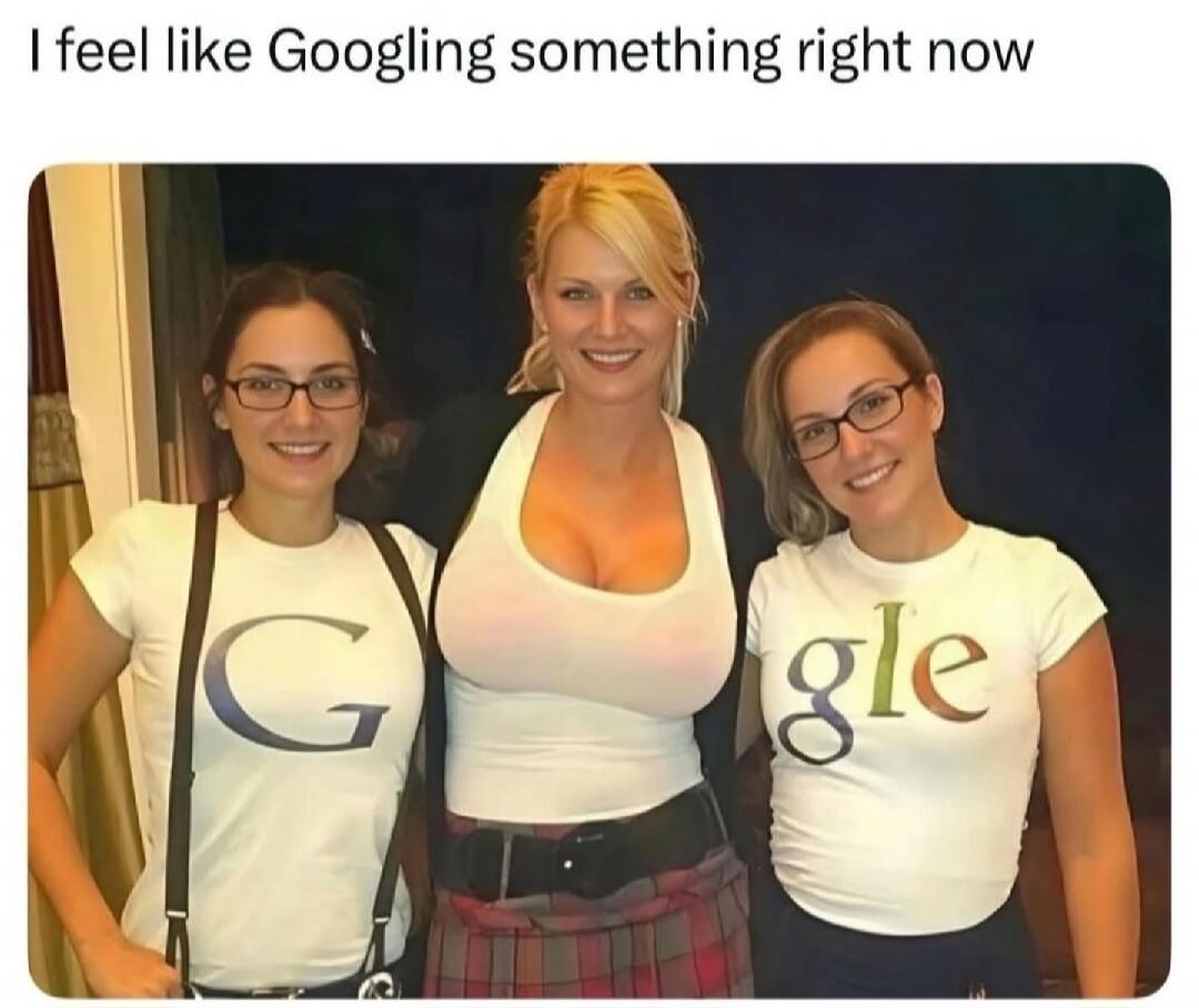I feel like Googling something right now. Three women are posing, their shirts collectively spell out 'Google'. The woman in the middle has a very large bust, visually representing the 'oo' in Google.