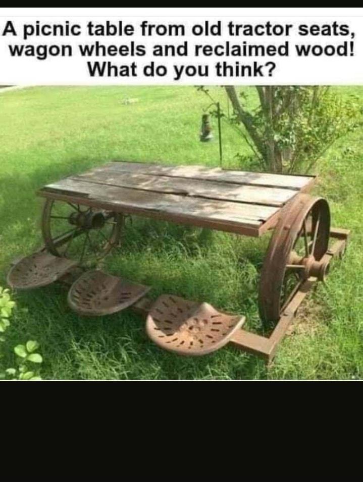 A picnic table from old tractor seats wagon wheels and reclaimed wood What do you think