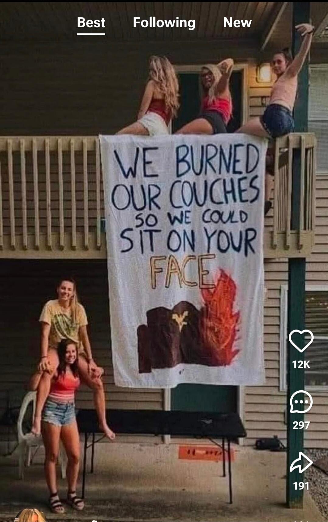WE BURNED OUR COUCHES SO WE COULD SIT ON YOUR FACE. Several young women are seen on a balcony, with two women on the lower level, one carrying the other on her shoulders.