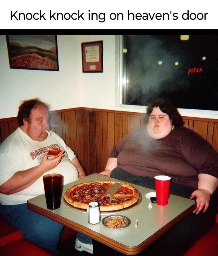 Knock knock ing on heaven's door. PIZZA. Two very overweight people are sitting at a table with a large pizza. Both are smoking, and the man is eating a slice of pizza.