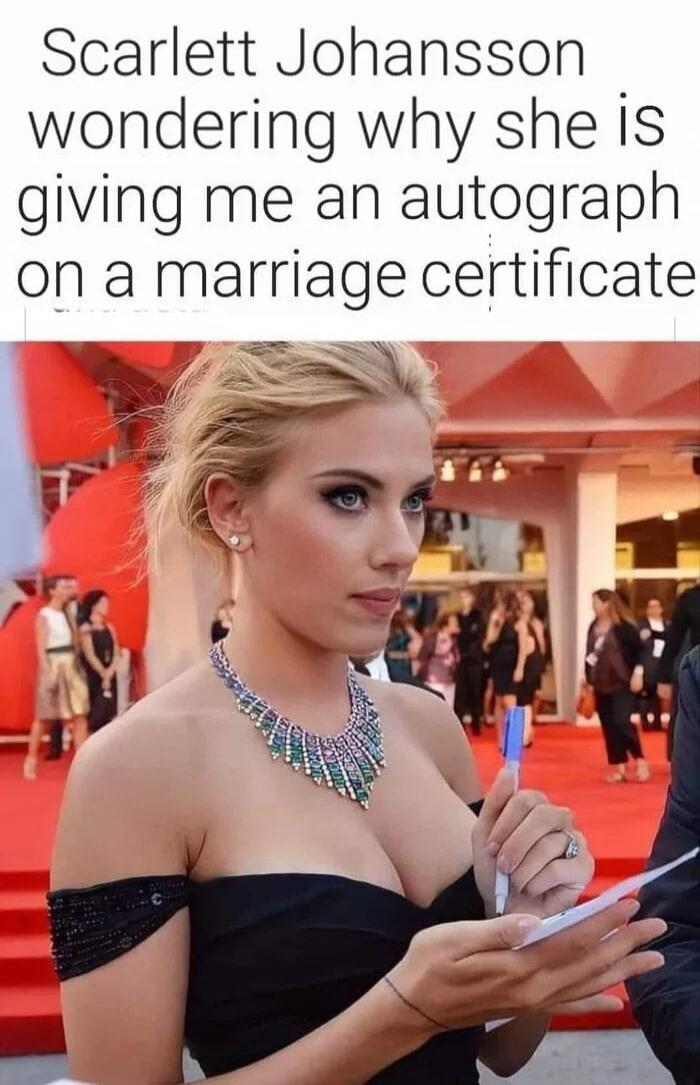 Scarlett Johansson wondering why she is giving me an autograph on a marriage certificate