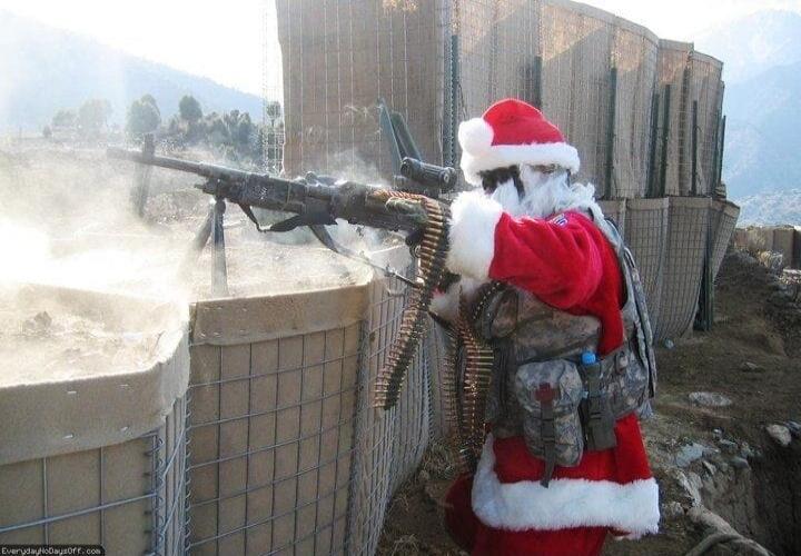 Santa Claus firing a heavy machine gun from a defensive position. The text 'EverydayNoDaysOff.com' is visible in the bottom left corner.
