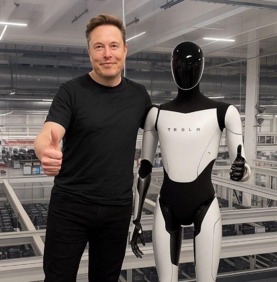 Elon Musk and the Tesla Optimus robot are standing side by side, both giving a thumbs-up. The robot has 'TESLA' written on its chest.