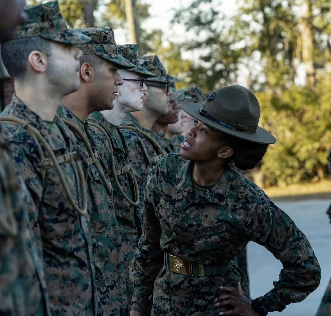 US Marines drill instructor inspecting recruits.