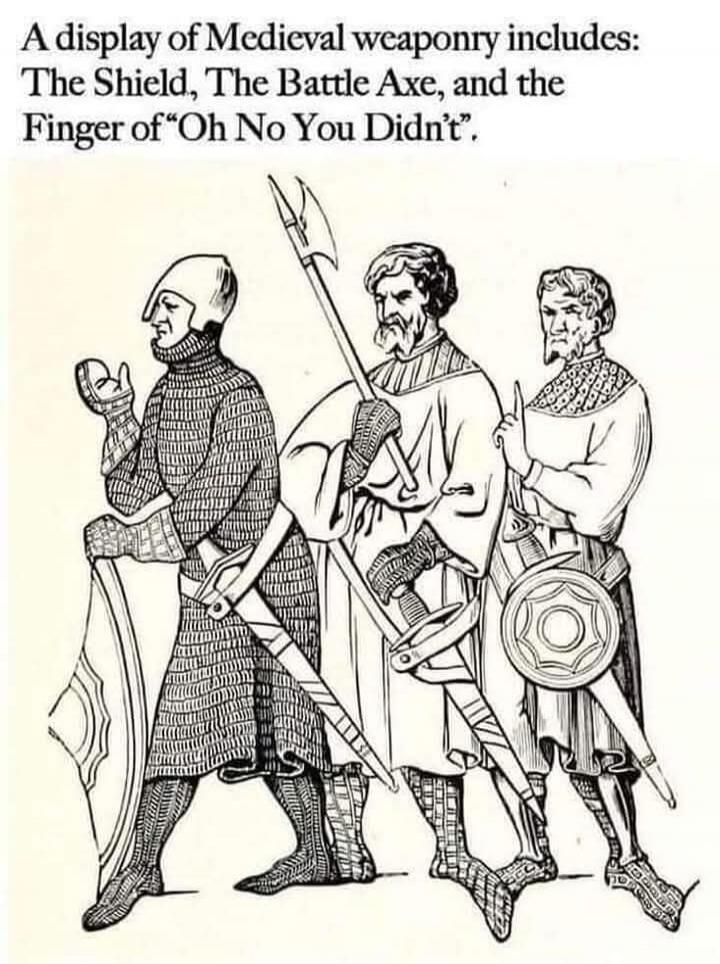 A display of Medieval weaponry includes: The Shield, The Battle Axe, and the Finger of “Oh No You Didn’t”.