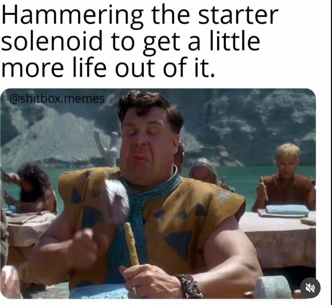 Hammering the starter solenoid to get a little more life out of it.