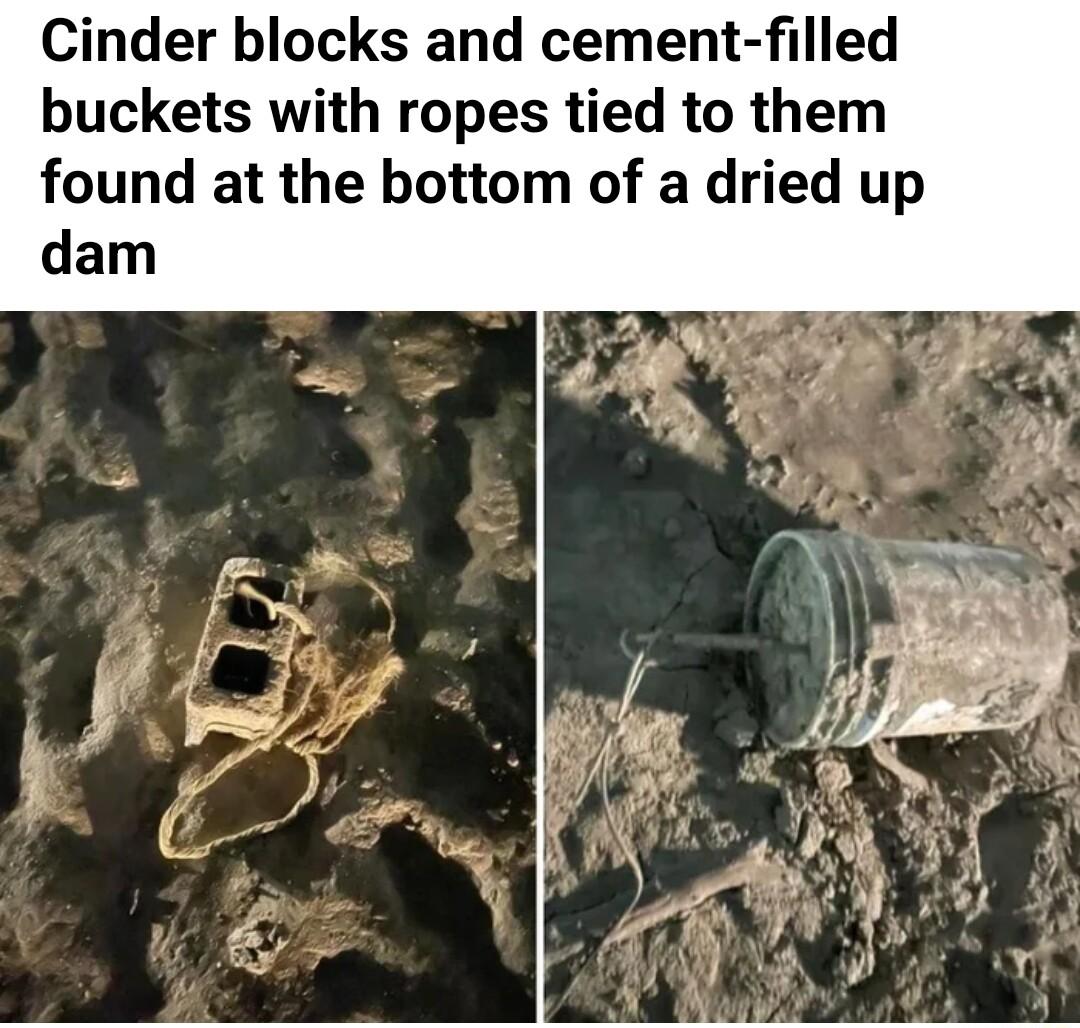 Cinder blocks and cement filled buckets with ropes tied to them found at the bottom of a dried up dam