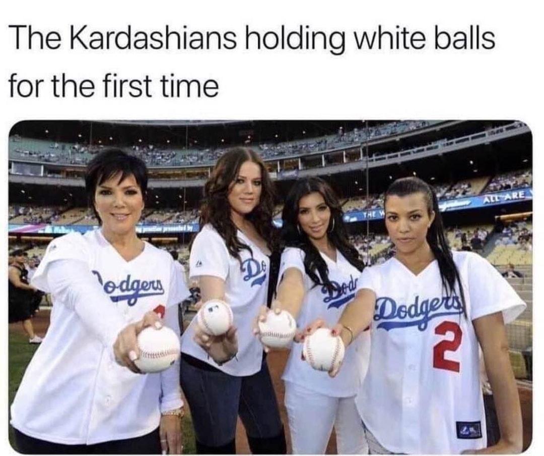 The Kardashians holding white balls for the first time