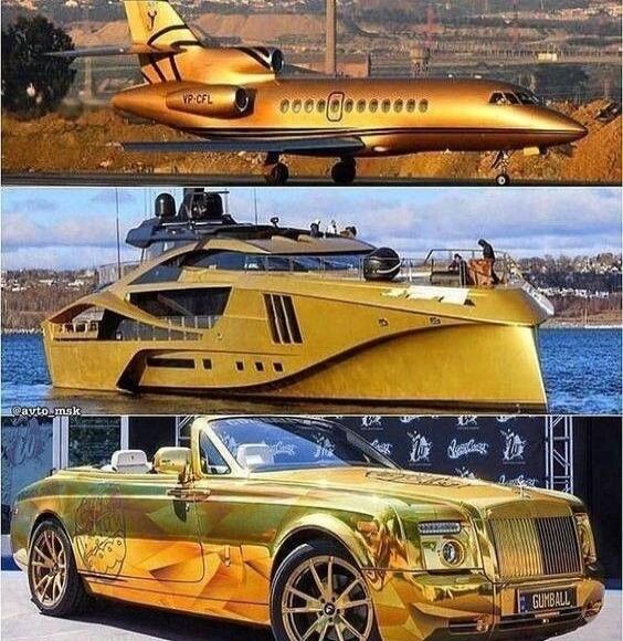 A golden private jet on a runway, a golden luxury yacht on the water, and a golden Rolls-Royce convertible car. The jet has 'VP-CFL' on its tail. The car has 'GUMBALL' on its license plate. There is also '@avto_msk' visible on the yacht image.